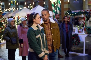 Italia Ricci and Michael Xavier in Trading Up Christmas